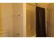 Clean bathroom with shower/tub combo and dark colored shower curtain at 117 Logan Pond Way, North Las Vegas, NV 89084