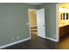 Bright bedroom with access to bathroom and laminate wood floors at 117 Logan Pond Way, North Las Vegas, NV 89084