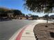 Curved roadway and landscaped community park at 117 Logan Pond Way, North Las Vegas, NV 89084