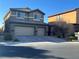 Two-story house with a two-car garage and landscaped yard at 117 Logan Pond Way, North Las Vegas, NV 89084