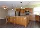 Kitchen boasts an island and stainless steel appliances at 117 Logan Pond Way, North Las Vegas, NV 89084