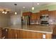 Modern kitchen with stainless steel appliances and an island at 117 Logan Pond Way, North Las Vegas, NV 89084