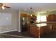 Modern kitchen with stainless steel appliances and an island at 117 Logan Pond Way, North Las Vegas, NV 89084