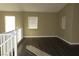 Open living area with dark laminate floors and white trim at 117 Logan Pond Way, North Las Vegas, NV 89084