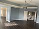 Main bedroom with high ceiling, chandelier, and hardwood floors at 117 Logan Pond Way, North Las Vegas, NV 89084