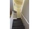 Elegant staircase with white railings at 117 Logan Pond Way, North Las Vegas, NV 89084