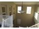 View of a bright two-story home's elegant stairwell at 117 Logan Pond Way, North Las Vegas, NV 89084