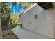 Landscaped backyard with grassy area at 3012 Plaza De Rosa, Las Vegas, NV 89102