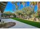 Backyard with patio and lush landscaping at 3012 Plaza De Rosa, Las Vegas, NV 89102