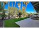 Landscaped backyard with patio and grassy area at 3012 Plaza De Rosa, Las Vegas, NV 89102