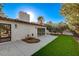 Backyard view showcasing patio and grass at 3012 Plaza De Rosa, Las Vegas, NV 89102