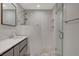 Contemporary bathroom with double vanity and frameless shower enclosure at 3012 Plaza De Rosa, Las Vegas, NV 89102