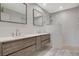 Modern bathroom with double vanity, wave-patterned shower and tile floor at 3012 Plaza De Rosa, Las Vegas, NV 89102