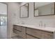 Modern bathroom with double vanity, floating cabinets, and updated fixtures at 3012 Plaza De Rosa, Las Vegas, NV 89102