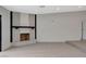 Modern fireplace with a white brick surround and dark wood mantle at 3012 Plaza De Rosa, Las Vegas, NV 89102