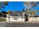 Single story home with a brick-paved driveway, a white garage door, and a terra cotta colored roof at 3012 Plaza De Rosa, Las Vegas, NV 89102