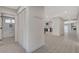 Bright hallway with access to laundry, kitchen, and living areas at 3012 Plaza De Rosa, Las Vegas, NV 89102