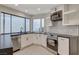 Modern kitchen with stainless steel appliances and corner sink at 3012 Plaza De Rosa, Las Vegas, NV 89102