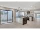 Modern kitchen with island, white cabinets, and stainless steel appliances at 3012 Plaza De Rosa, Las Vegas, NV 89102