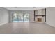 Spacious living area with hardwood floors, fireplace and sliding glass doors at 3012 Plaza De Rosa, Las Vegas, NV 89102