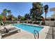 Community pool with lounge chairs at 3012 Plaza De Rosa, Las Vegas, NV 89102