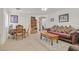 Spacious living room with wooden furniture and a bookcase at 6058 Ambleshire Ave, Las Vegas, NV 89139