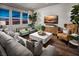 Spacious living room with city views and modern furniture at 10356 Aquila Crest Ave, Las Vegas, NV 89166