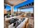 Relaxing outdoor patio with seating area and built-in grill at 10356 Aquila Crest Ave, Las Vegas, NV 89166