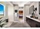 Spa-like bathroom with double vanity, large mirror, and walk-in shower at 10363 Vista Argento Ave, Las Vegas, NV 89166