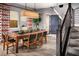 Dining area with wood table and chairs, hardwood floors, and stylish decor at 10363 Vista Argento Ave, Las Vegas, NV 89166