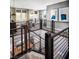 Upstairs loft area with open railing and stylish decor at 10363 Vista Argento Ave, Las Vegas, NV 89166