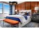 Spacious bedroom with wood accent wall, large bed, and plenty of natural light at 10363 Vista Argento Ave, Las Vegas, NV 89166