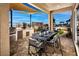 Outdoor kitchen and dining area with shaded pergola at 10363 Vista Argento Ave, Las Vegas, NV 89166