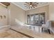 Spacious living room with large windows and a ceiling fan at 1206 Peach Bluff Ct, Henderson, NV 89002