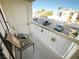 Relaxing balcony with patio furniture and views of the parking lot at 1904 Las Palmas Ln # 203, Laughlin, NV 89029