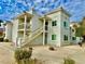 Two-story condo building with white exterior and stairs at 1904 Las Palmas Ln # 203, Laughlin, NV 89029