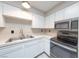 Kitchen with white cabinets and stainless steel appliances at 1904 Las Palmas Ln # 203, Laughlin, NV 89029