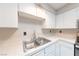Clean kitchen featuring a double sink and ample counter space at 1904 Las Palmas Ln # 203, Laughlin, NV 89029