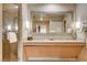 Bathroom with double vanity, granite countertop and a large mirror at 211 E Flamingo Rd # 1018, Las Vegas, NV 89169