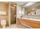 Bathroom with a shower, toilet and double vanity at 211 E Flamingo Rd # 1018, Las Vegas, NV 89169