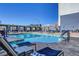 Relaxing rooftop pool with comfortable lounge chairs at 211 E Flamingo Rd # 1018, Las Vegas, NV 89169