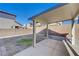 Covered patio and grassy backyard with block wall fencing at 4132 Spring Storm Ave, North Las Vegas, NV 89081