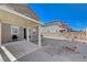 Covered patio adjacent to the house, overlooking the backyard at 4132 Spring Storm Ave, North Las Vegas, NV 89081