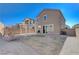 Large backyard featuring a two-story home and covered patio at 4132 Spring Storm Ave, North Las Vegas, NV 89081