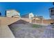 Spacious backyard with covered patio and grassy area at 4132 Spring Storm Ave, North Las Vegas, NV 89081