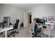 Home office featuring two workspaces and a closet at 4132 Spring Storm Ave, North Las Vegas, NV 89081