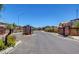Gated community entrance with a paved road at 4132 Spring Storm Ave, North Las Vegas, NV 89081