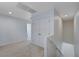 Upstairs hallway with double doors, carpet, and access to bedrooms at 4132 Spring Storm Ave, North Las Vegas, NV 89081