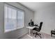 Bright home office features a large window, desk, and comfortable chair at 4132 Spring Storm Ave, North Las Vegas, NV 89081