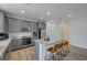 Modern kitchen with gray cabinets, granite countertops, and stainless steel appliances at 4132 Spring Storm Ave, North Las Vegas, NV 89081